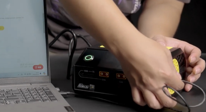 Use one end of the USB cable in the box to connect to the charger upgrade port